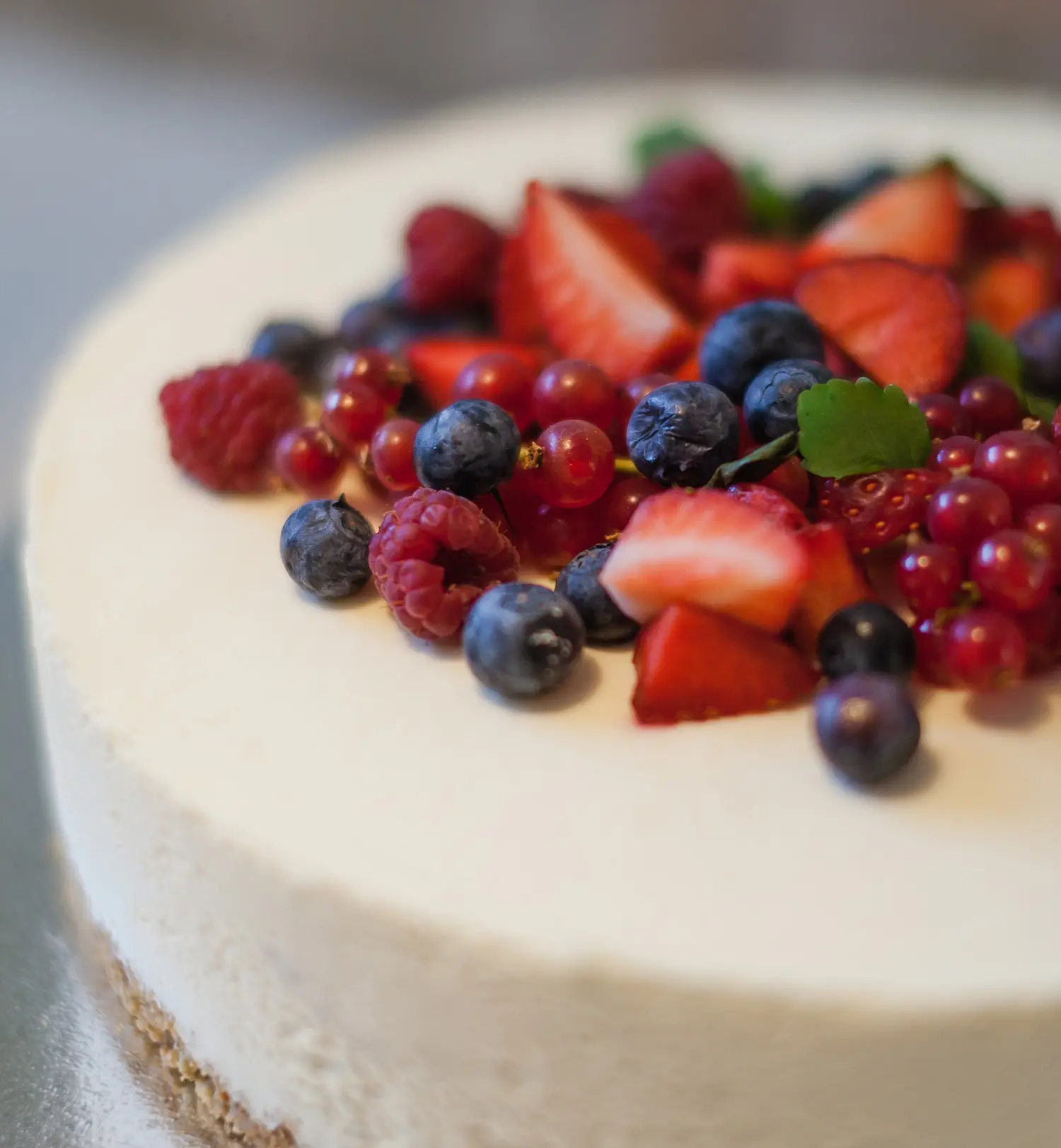 Vanilla Cake with Strawberries and Blueberries on Top