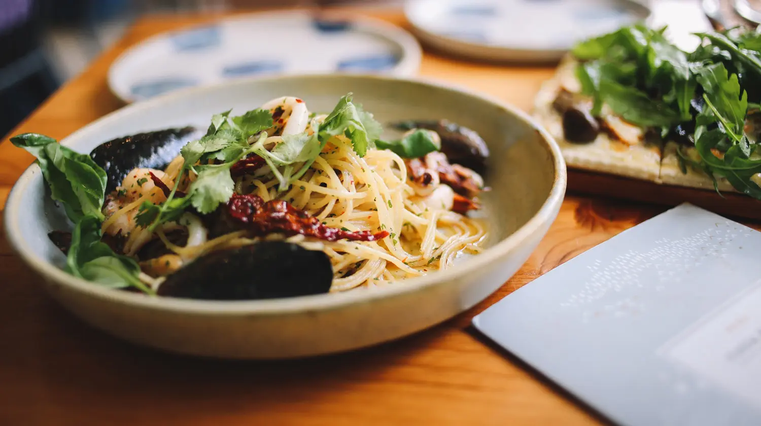 Pasta with greens and meat sauce